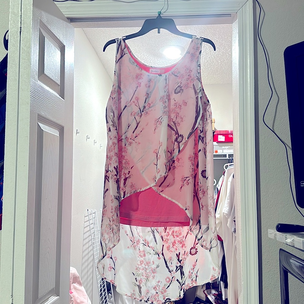 Pink and white floral sleeveless blouse